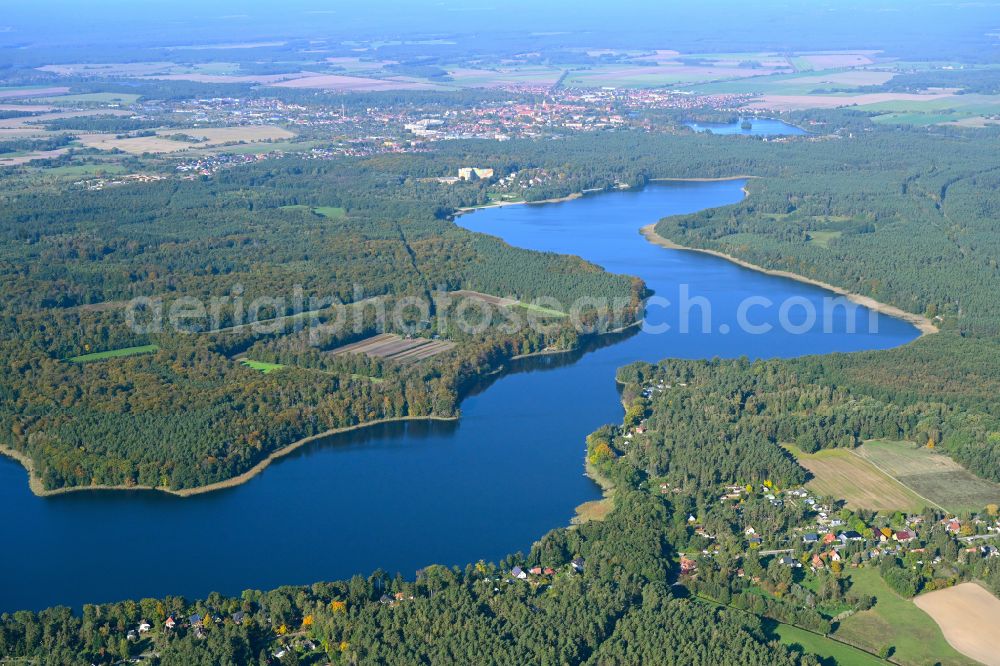 Aerial photograph Ahrensdorf - Riparian areas on the lake area of Luebbesee in a forest area in Ahrensdorf in the state Brandenburg, Germany