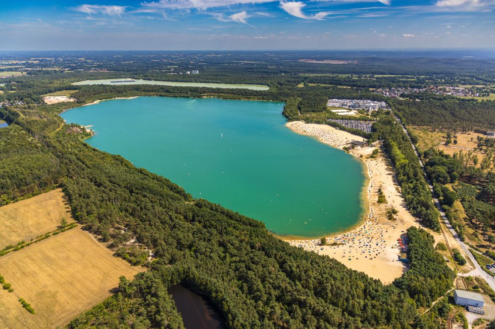 Lehmbraken from above - Aerial view of the shore areas at the lake area of Silbersee II in Lehmbraken in the federal state of North Rhine-Westphalia, Germany. Today's bathing lake was used for quartz sand extraction