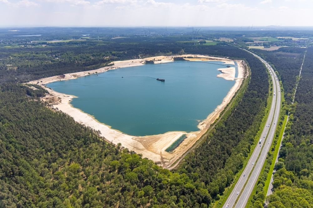 Aerial image Haltern am See - Aerial view of the Silver Lake with quartz sand extraction in a forest area in the district of Lehmbraken in Haltern am See in the Ruhr area in North Rhine-Westphalia, Germany