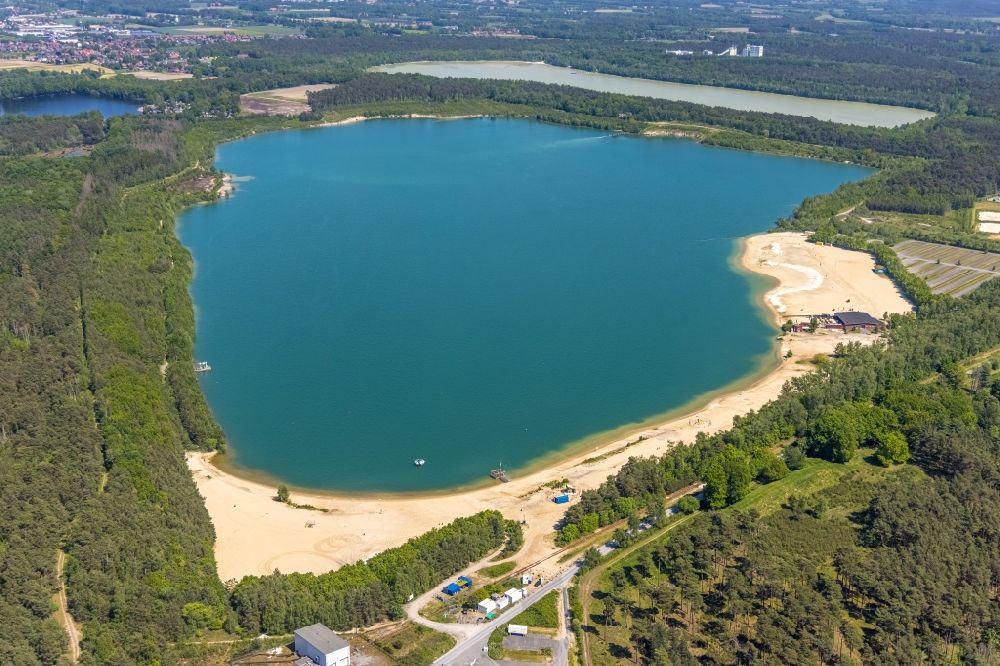 Haltern am See from the bird's eye view: Aerial view of the Silver Lake with quartz sand extraction in a forest area in the district of Lehmbraken in Haltern am See in the Ruhr area in North Rhine-Westphalia, Germany