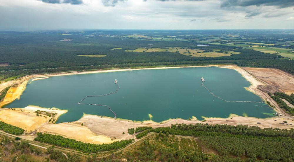 Haltern am See from the bird's eye view: Aerial view of the Silver Lake with quartz sand extraction in a forest area in the district of Lehmbraken in Haltern am See in the Ruhr area in North Rhine-Westphalia, Germany