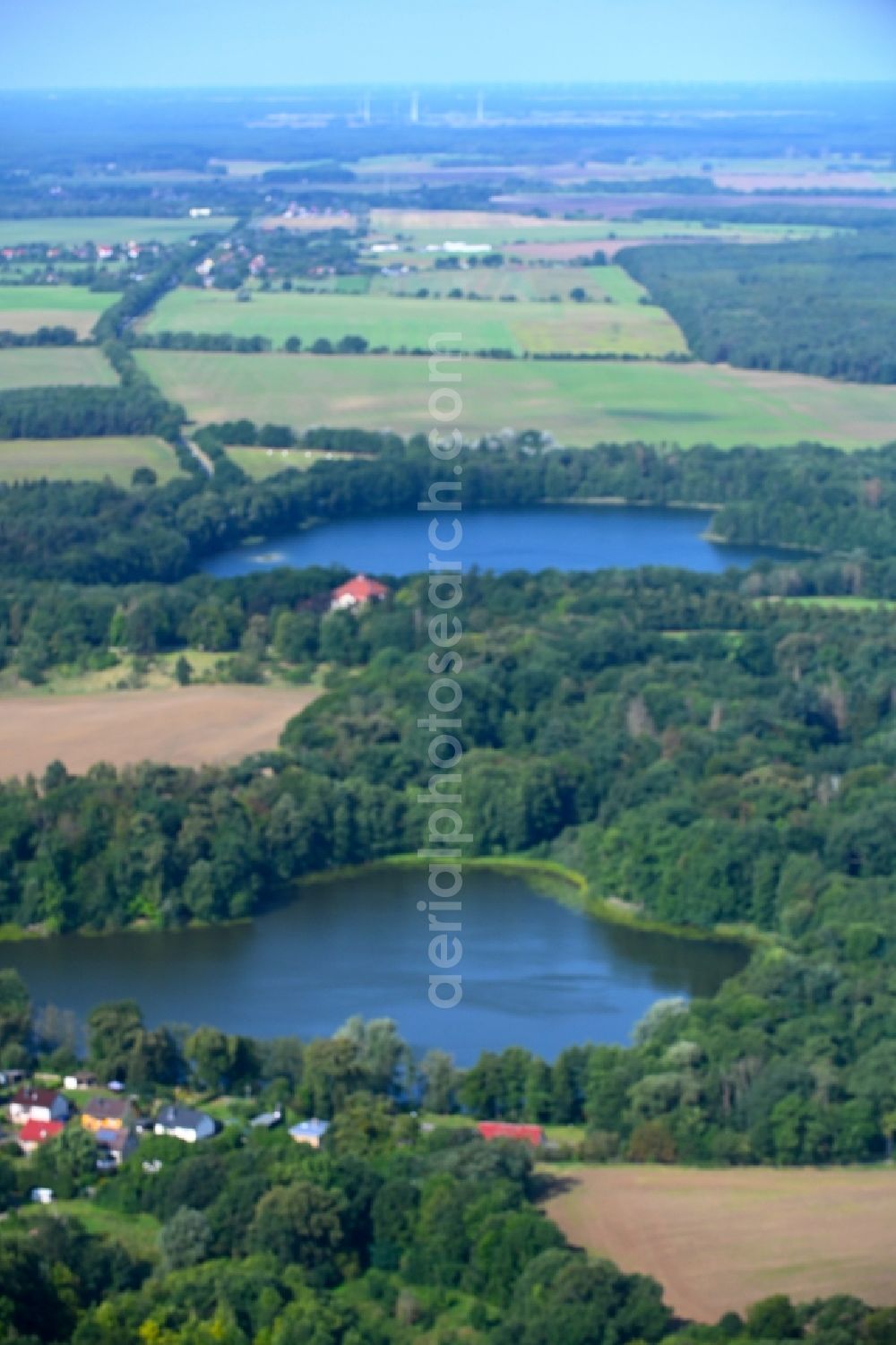 Aerial photograph Liebenberg - Riparian areas on the lake area of Weisser See in a forest area in Liebenberg in the state Brandenburg, Germany