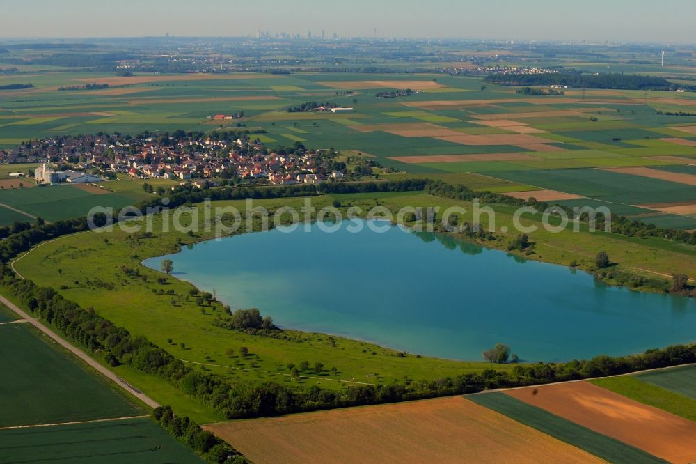 Weckesheim from the bird's eye view: Shore areas of the ponds for fish farming in Weckesheim in the state Hesse, Germany