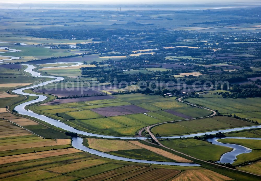 Süderhöft from above - Curved loop of the riparian zones on the course of the river Treene in Suederhoeft in the state Schleswig-Holstein, Germany