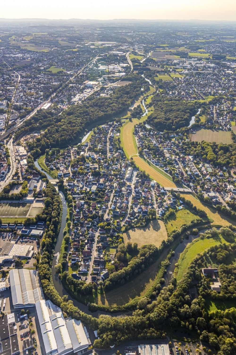 Aerial image Bad Oeynhausen - Curved loop of the riparian zones on the course of the river Weser with residential area of a single-family housing estate in Bad Oeynhausen in the state North Rhine-Westphalia, Germany
