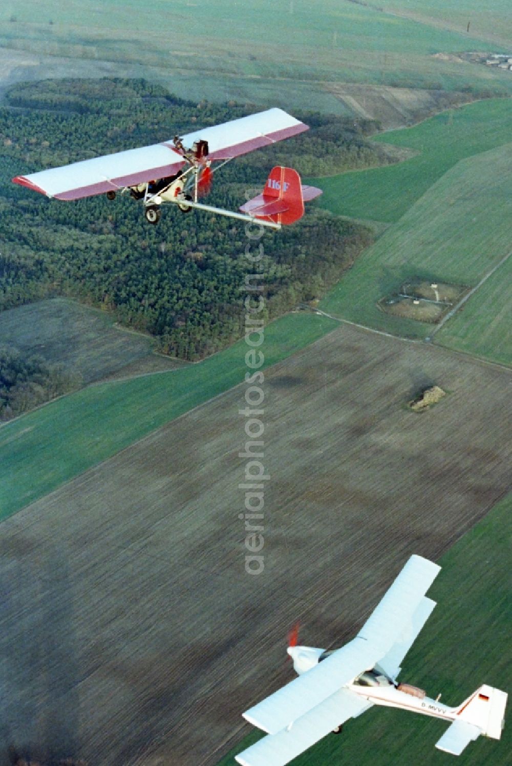 Aerial image Eggersdorf - Ultralight aircraft in flight above the sky MISTRAL with the identifier D-MVVV in formation with a skywalker airplane in Eggersdorf in the state Brandenburg, Germany