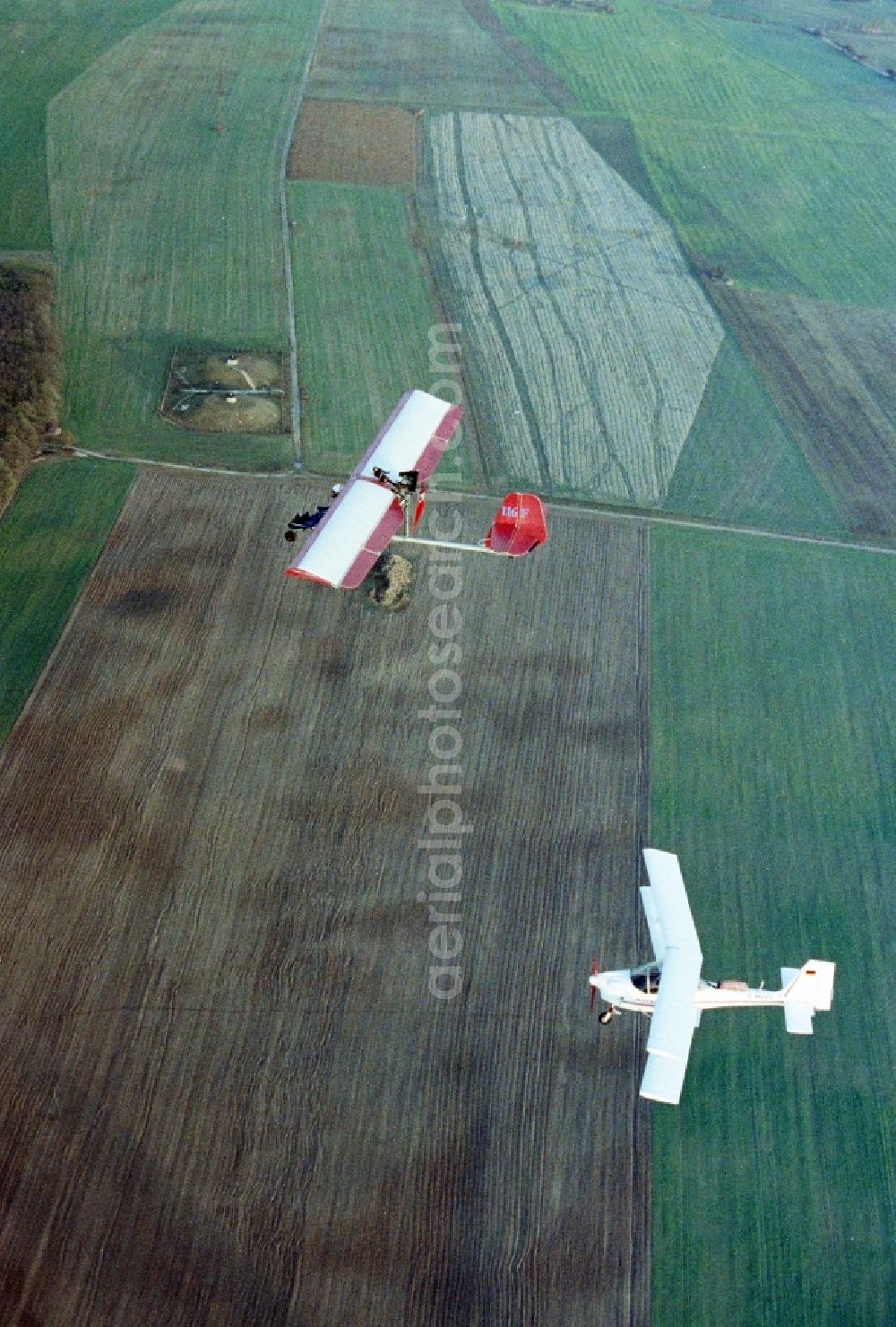 Aerial photograph Eggersdorf - Ultralight aircraft in flight above the sky MISTRAL with the identifier D-MVVV in formation with a skywalker airplane in Eggersdorf in the state Brandenburg, Germany