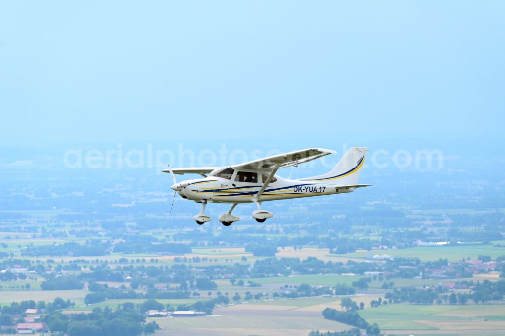 Aerial image Wagenfeld - Ultralight aircraft TL-3000 Sirius with the identifier OK-YUA17 in flight above the sky in Wagenfeld in the state Lower Saxony, Germany