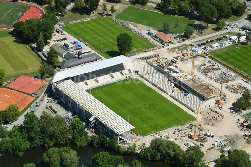 Jena from above - With the conversion and expansion of the sports facility grounds of the Ernst-Abbe-Sportfeld stadium, new grandstands with a complete roof are being built on the street Roland-Ducke-Weg in the district Obere Aue in Jena in the state of Thuringia, Germany