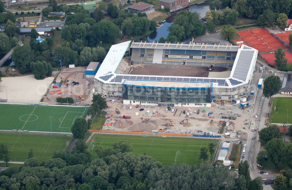 Aerial photograph Jena - With the conversion and expansion of the sports facility grounds of the Ernst-Abbe-Sportfeld stadium, new grandstands with a complete roof are being built on the street Roland-Ducke-Weg in the district Obere Aue in Jena in the state of Thuringia, Germany