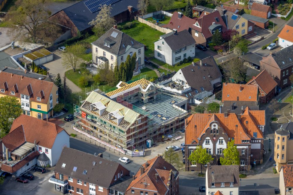Aerial photograph Rhynern - Construction site for the conversion and expansion of the residential building on the street Auf dem Tigge in Rhynern in the Ruhr area in the state North Rhine-Westphalia, Germany