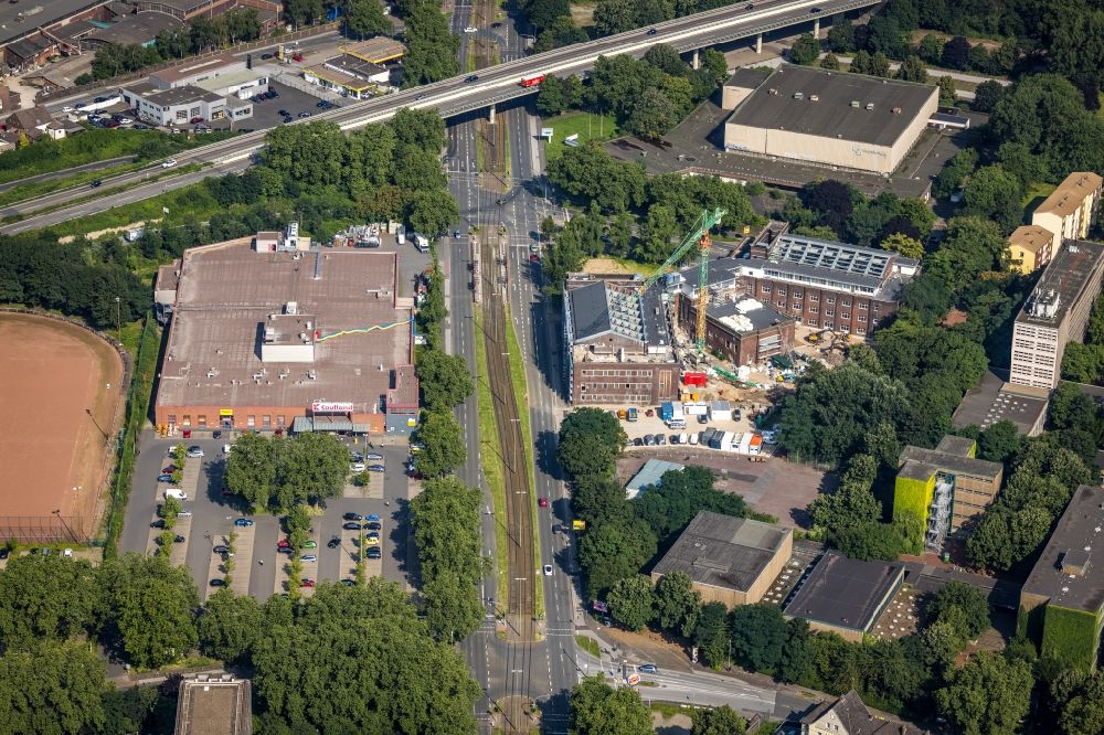 Aerial image Duisburg - Construction site for reconstruction and modernization and renovation of an office and commercial building formerly the city indoor swimming pool on Walther-Rathenau-Strasse corner Duisburger Strasse in the district Obermarxloh in Duisburg at Ruhrgebiet in the state North Rhine-Westphalia, Germany