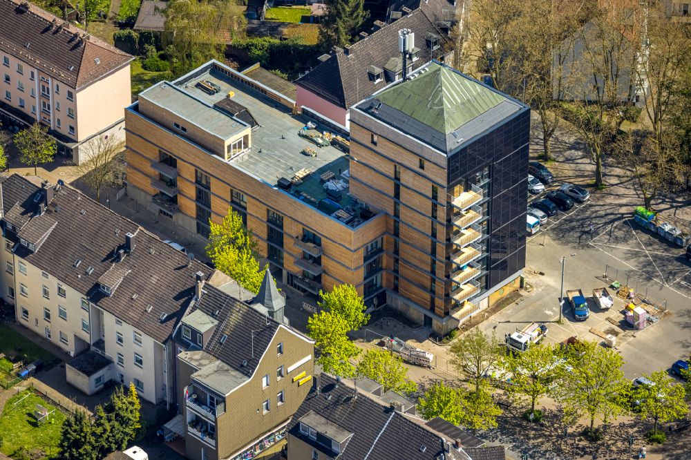 Aerial photograph Herne - Construction site for the conversion and new modernization work on the bunker building complex for the residential building we-house Herne on Kurt-Edelhagen-Platz in Herne in the state North Rhine-Westphalia, Germany