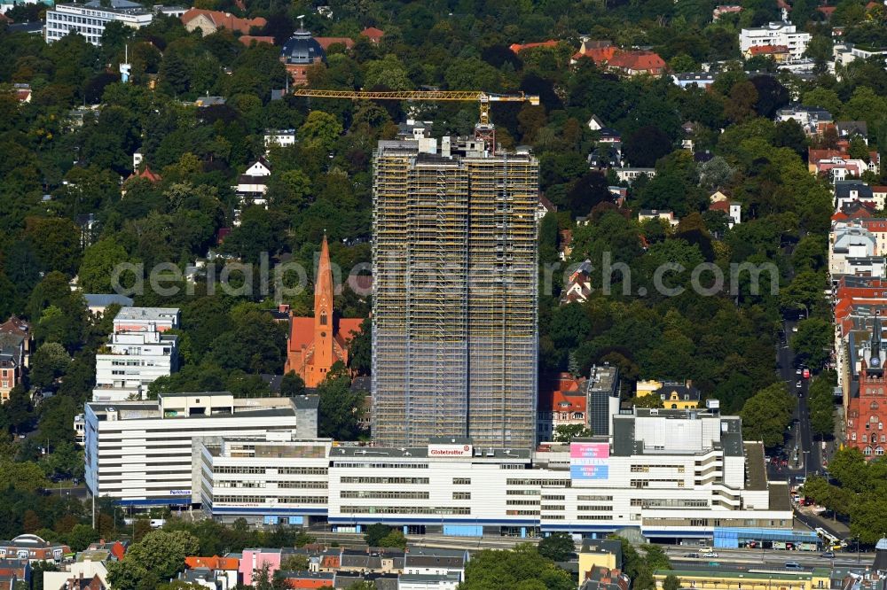 Aerial image Berlin - Construction site for the reconstruction of the high-rise building and building complex Steglitzer Kreisel - UBERLIN residential tower on Schlossstrasse in the district of Steglitz in Berlin