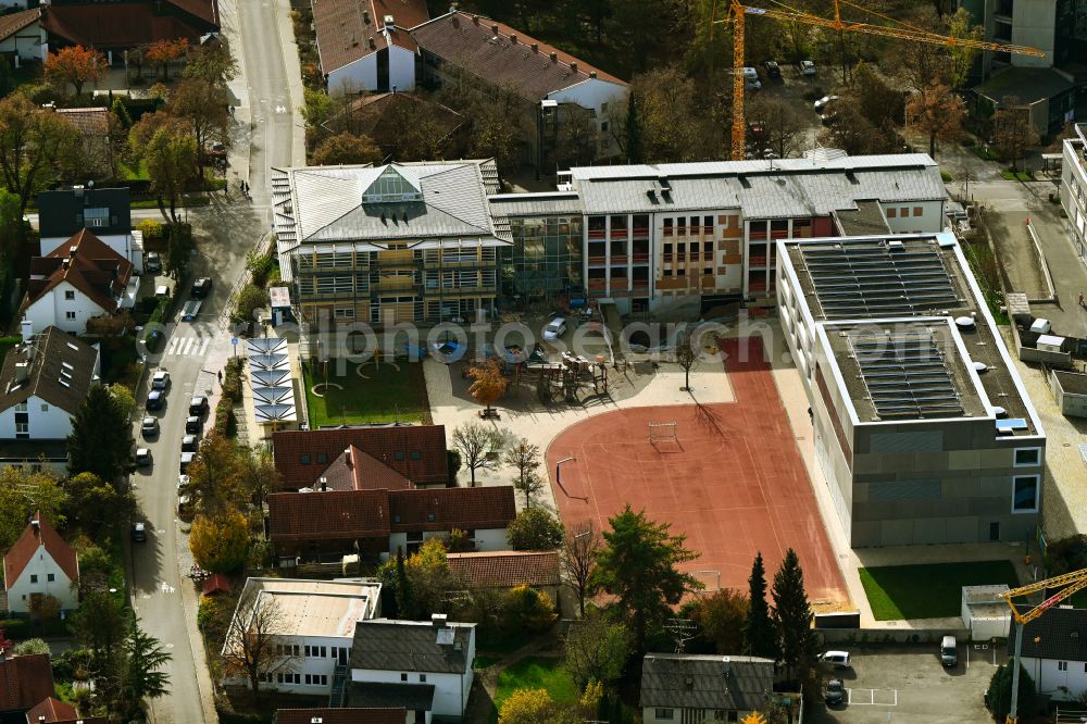 Aerial image Unterföhring - Construction sites for the conversion, expansion and modernization of the school building a primary school on street Bahnhofstrasse in the district Unterfoehring on street Bahnhofstrasse in Unterfoehring in the state Bavaria, Germany