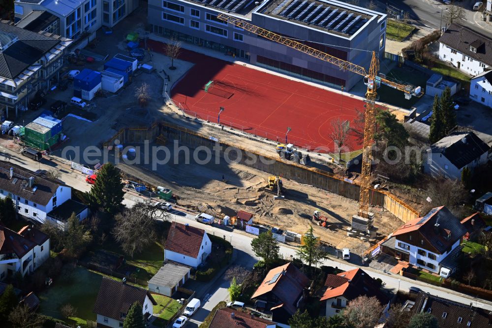Unterföhring from above - Construction sites for the conversion, expansion and modernization of the school building a primary school on street Bahnhofstrasse in the district Unterfoehring on street Bahnhofstrasse in Unterfoehring in the state Bavaria, Germany