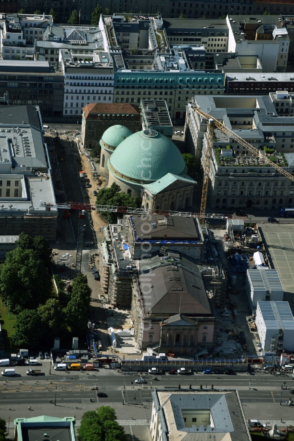 Berlin from above - View of the reconstruction and renovation of the building of the Staatsoper Unter den Linden in Berlin at Bebelplatz. It is the oldest opera house and theater building in Berlin. A new building will serve as stacks and warehouse for the Staatsoper Komplex. The architect HG Merz is a overseeing the reconstruction of the historical building complex