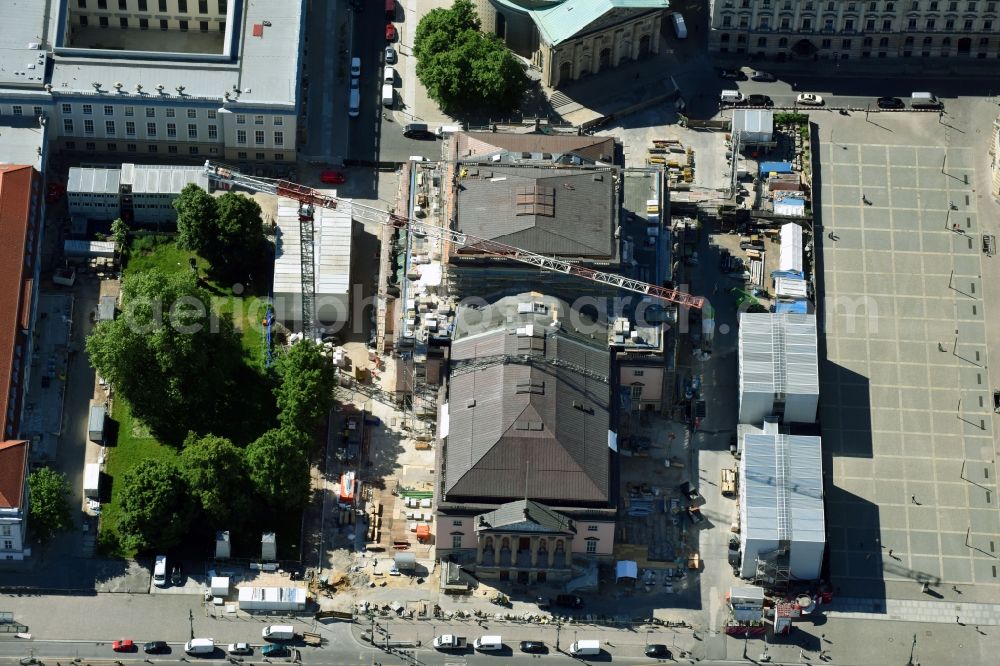 Berlin from above - Reconstruction and renovation of the building of the Staatsoper Unter den Linden in Berlin at Bebelplatz. It is the oldest opera house and theater building in Berlin. A new building will serve as stacks and warehouse for the Staatsoper Komplex. The architect HG Merz is a overseeing the reconstruction of the historical building complex