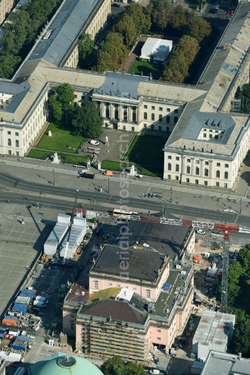 Berlin from above - Reconstruction and renovation of the building of the Staatsoper Unter den Linden in Berlin at Bebelplatz. It is the oldest opera house and theater building in Berlin. A new building will serve as stacks and warehouse for the Staatsoper Komplex. The architect HG Merz is a overseeing the reconstruction of the historical building complex