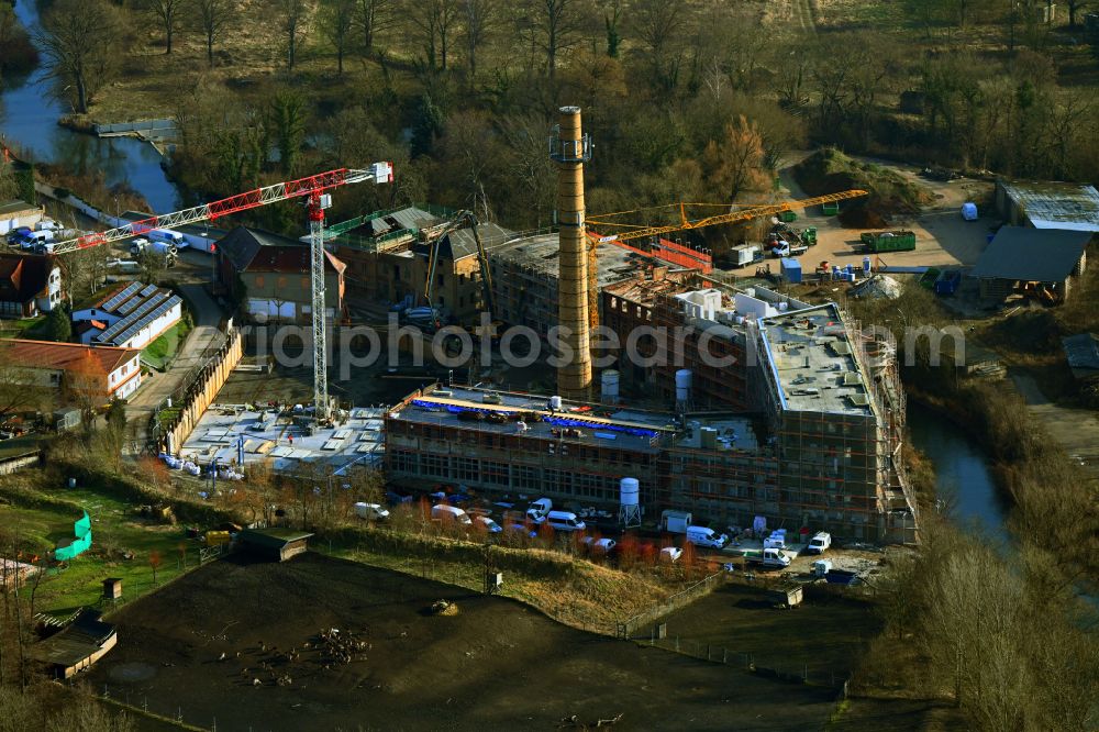 Aerial photograph Schkeuditz - Conversion construction site to modernize and renovate the factory premises of the old paper factory on Fabrikstrasse into apartments in the district of Wehlitz in Schkeuditz in the state Saxony, Germany