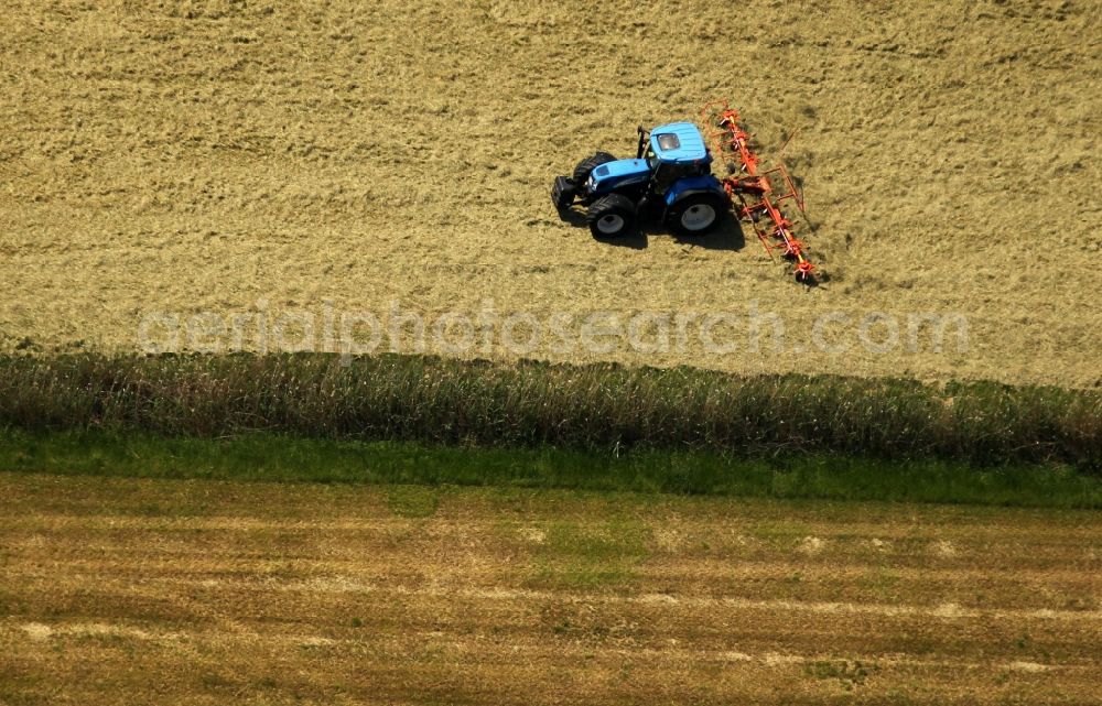 Aerial photograph Freyburg (Unstrut) - Plowing and shifting the earth by a tractor with plow on agricultural fields in Freyburg (Unstrut) in the state Saxony-Anhalt, Germany