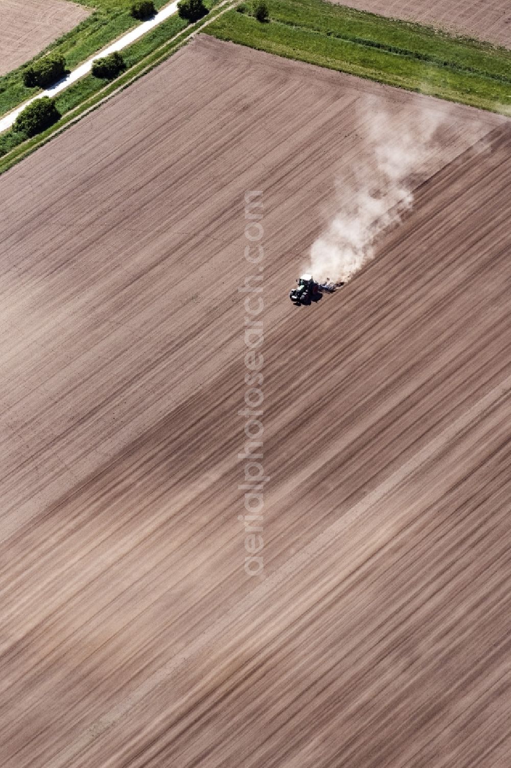 Aerial image Worms - Plowing and shifting the earth by a tractor with plow on agricultural fields in Worms in the state Rhineland-Palatinate, Germany