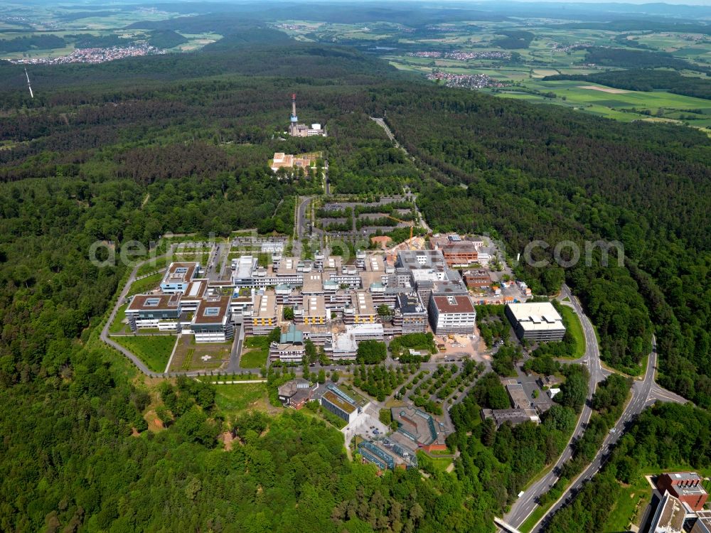 Aerial photograph Marburg - University Hospital of Giessen and Marburg in Marburg in the state of Hesse. The hospital is divided in two locations, the site in Marburg is located on the Lahn mountains in the East of the city and is surrounded by forest. Visible here is the main building and parking lots on a hill. It belongs to the Rhoen Klinikum company