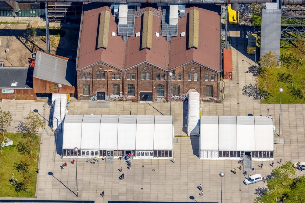 Aerial photograph Dortmund - Building of the indoor arena of the Warsteiner Music Hall with Corona rapid test and vaccination center on Phoenixplatz in the district Phoenix-West in Dortmund at Ruhrgebiet in the state North Rhine-Westphalia, Germany
