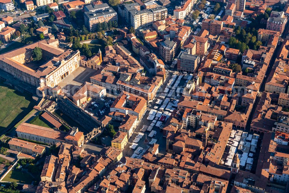 Sassuolo from the bird's eye view: Sale and food stands and trade stalls in the market place near Palazzo Ducale on street via Racchetta in Sassuolo in Emilia-Romagna, Italy