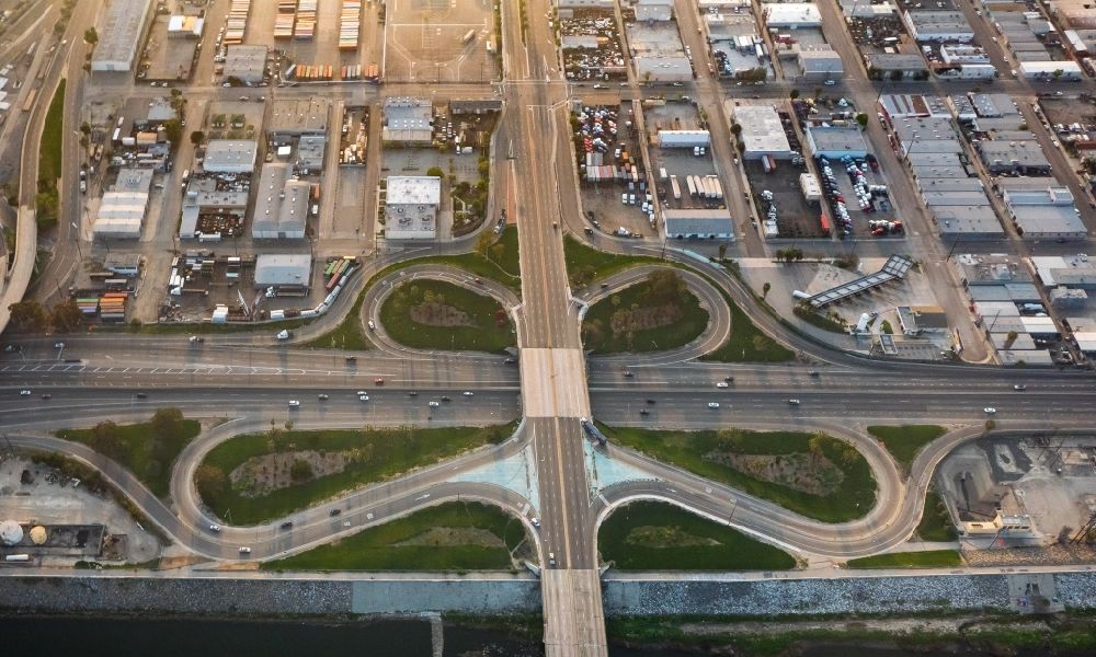 Aerial image Long Beach - Motorway clover leaf interchange of Interstate 710 and Pacific Coast Highway in Long Beach in California, USA
