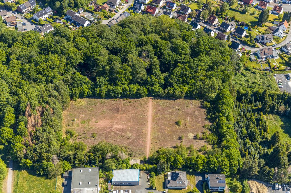 Arnsberg from the bird's eye view: Abandoned sports field in the industrial and commercial area along the Weberstrasse in Arnsberg in the state North Rhine-Westphalia, Germany