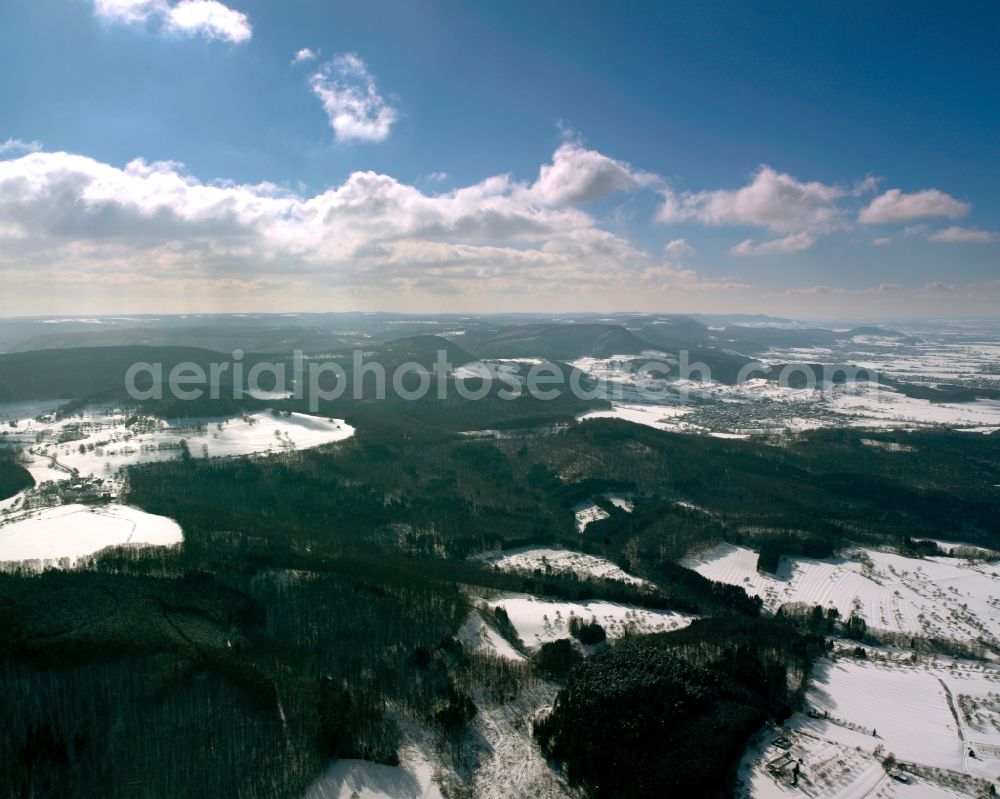 Aerial image Göppingen - Snowed in winter landscape in the county district of Göppingen in the state of Baden-Württemberg. Acres, fields, forests and greens are cover by the snow and lie in the sun. The region is in the outland of the Schwäbische Alb area. Only little streets are cleared
