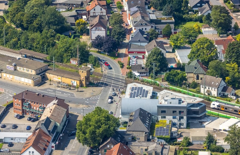 Bönen from the bird's eye view: Banking administration building of the financial services company Volksbank Boenen eG next to the track course on Bahnhofstrasse in the district Nordboegge in Boenen in the state North Rhine-Westphalia, Germany