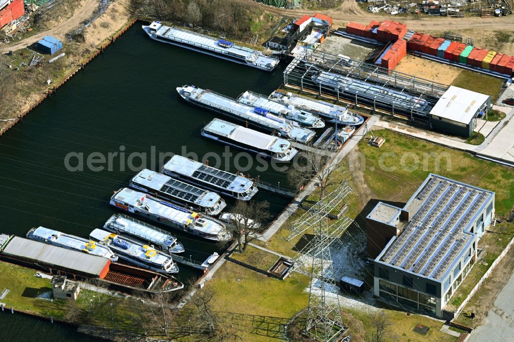 Berlin from above - Fully occupied ship moorings at the harbor basin of the inland port for passenger ships and ferries of the Riedel shipping company on Nalepastrasse in the Oberschoeneweide district in Berlin, Germany
