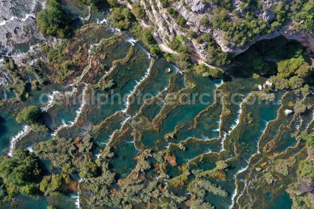 Aerial image Bogatic - Valley landscape surrounded by mountains in Bogatic on river krka in Sibensko-kninska zupanija, Croatia