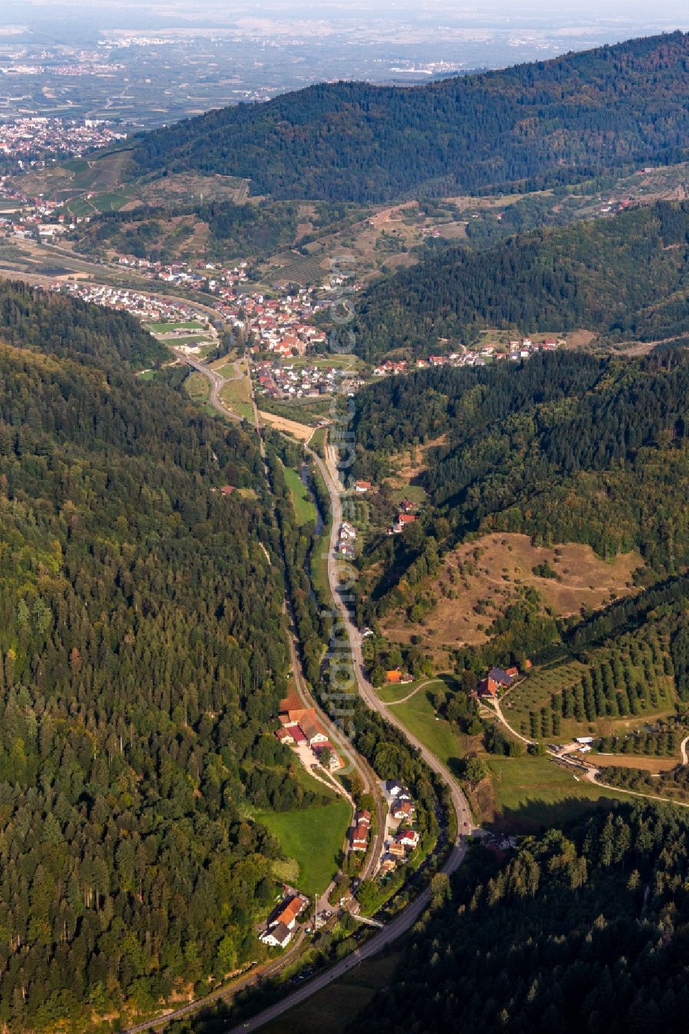 Lautenbach from above - Valley landscape surrounded by mountains with B38, mill dig and Renchtal-rail-track in Lautenbach in the state Baden-Wuerttemberg, Germany