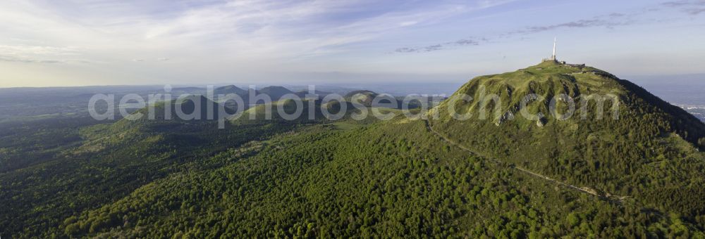 Orcines from the bird's eye view: Valley landscape surrounded by mountains Puy de Dome in Orcines in Auvergne-Rhone-Alpes, France