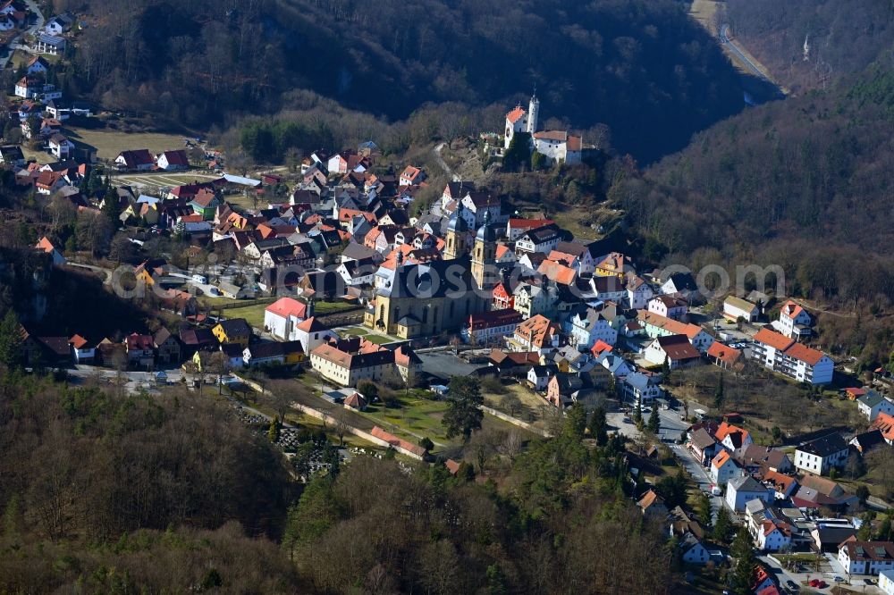Gößweinstein from above - Surrounded by forest and forest areas center of the streets and houses and residential areas in Goessweinstein at Fraenkische Schweiz in the state Bavaria, Germany