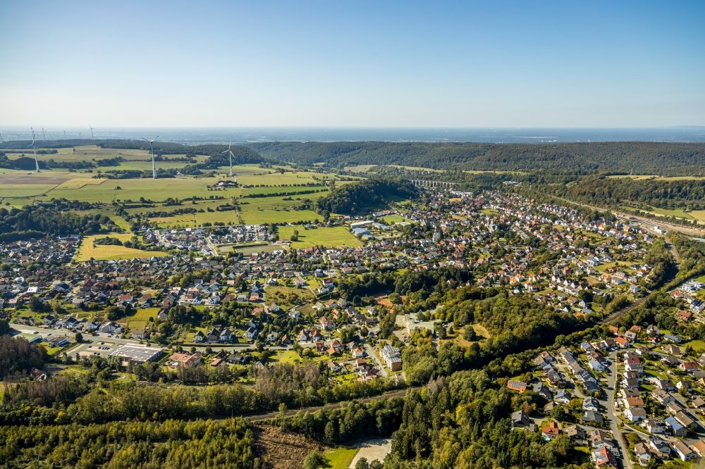 Aerial photograph Altenbeken - Surrounded by forest and forest areas center of the streets and houses and residential areas in Altenbeken in the state North Rhine-Westphalia, Germany