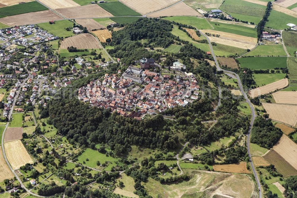 Amöneburg from the bird's eye view: Surrounded by forest and forest areas center of the streets and houses and residential areas in Amoeneburg in the state Hesse, Germany