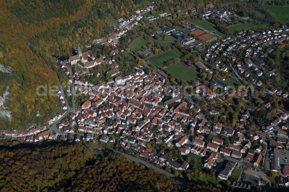 Blaubeuren from above - Surrounded by forest and forest areas center of the streets and houses and residential areas in Blaubeuren in the state Baden-Wuerttemberg, Germany