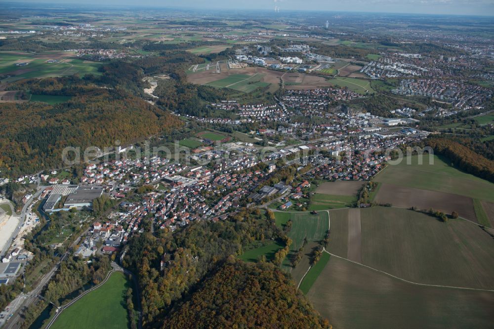 Blaustein from above - Surrounded by forest and forest areas center of the streets and houses and residential areas in Blaustein in the state Baden-Wuerttemberg, Germany