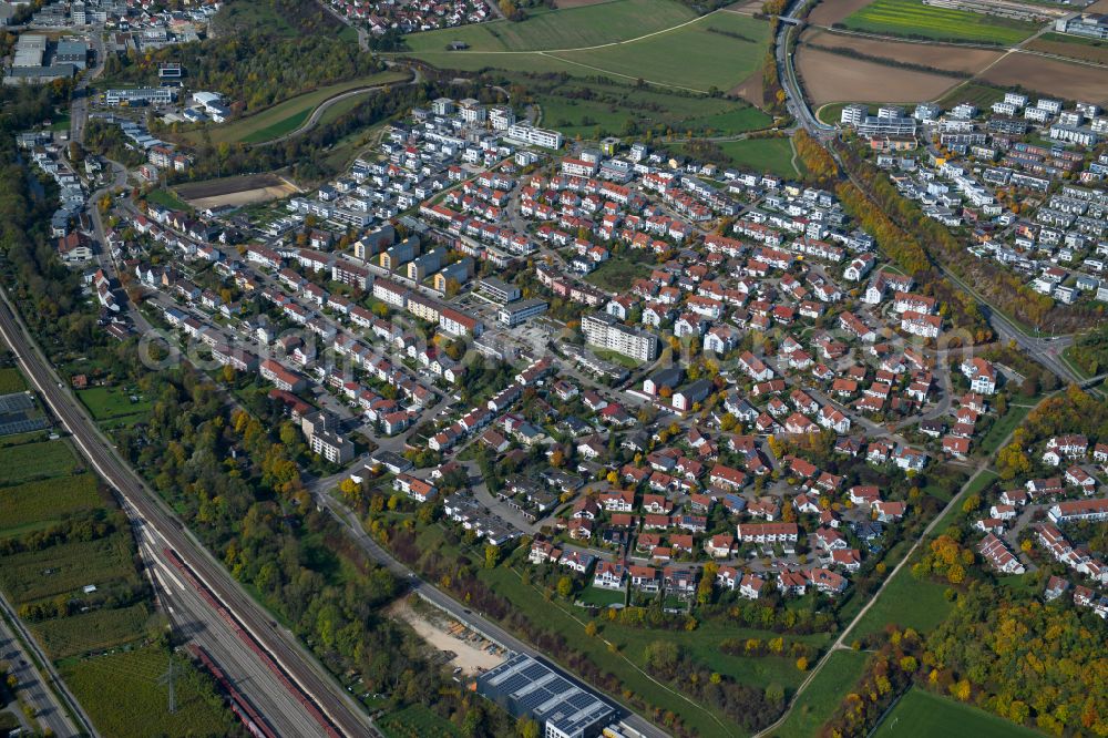 Blaustein from above - Surrounded by forest and forest areas center of the streets and houses and residential areas in Blaustein in the state Baden-Wuerttemberg, Germany