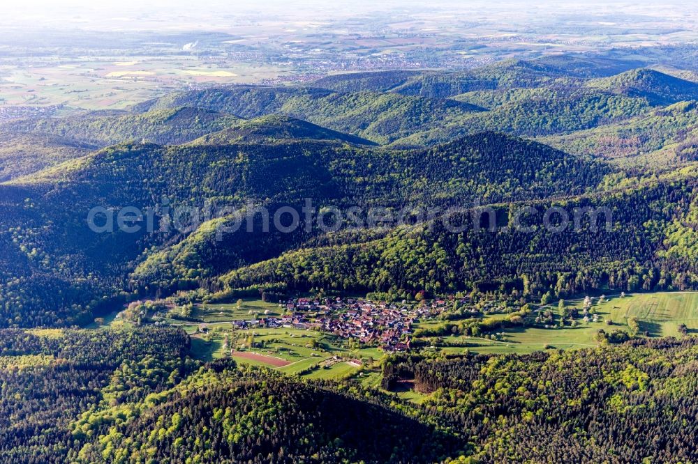 Böllenborn from the bird's eye view: Surrounded by forest and forest areas center of the streets and houses and residential areas in Boellenborn in the state Rhineland-Palatinate, Germany