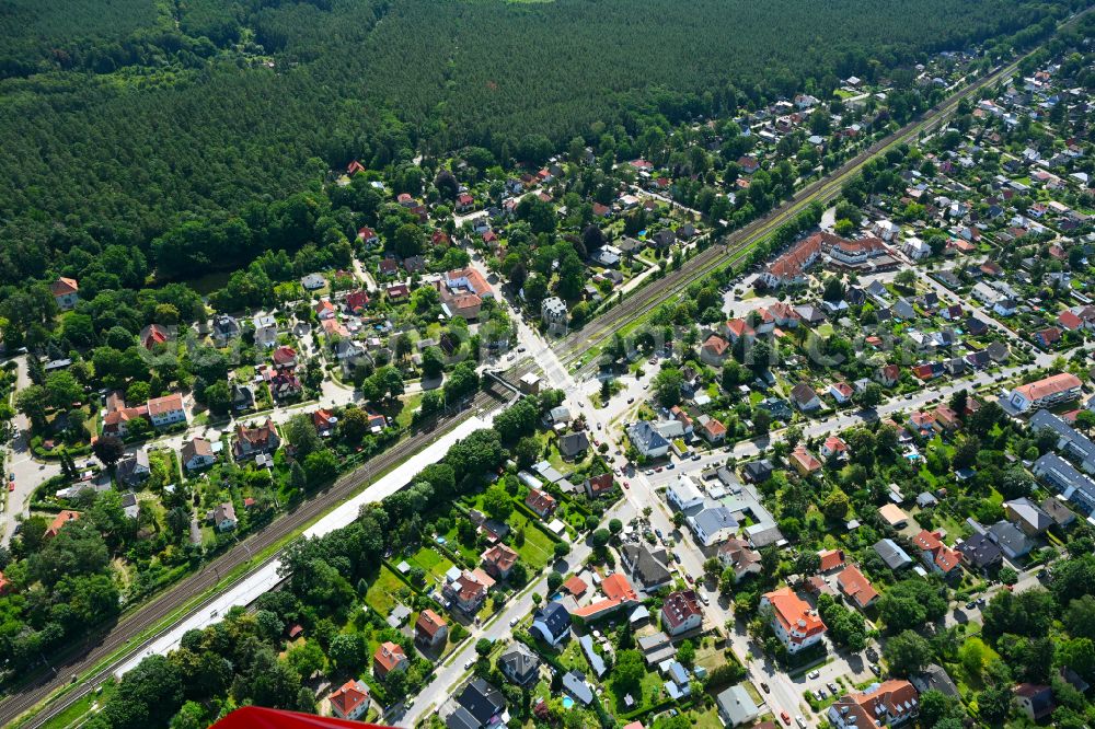 Aerial photograph Borgsdorf - Surrounded by forest and forest areas center of the streets and houses and residential areas on street Bahnhofstrasse in Borgsdorf in the state Brandenburg, Germany