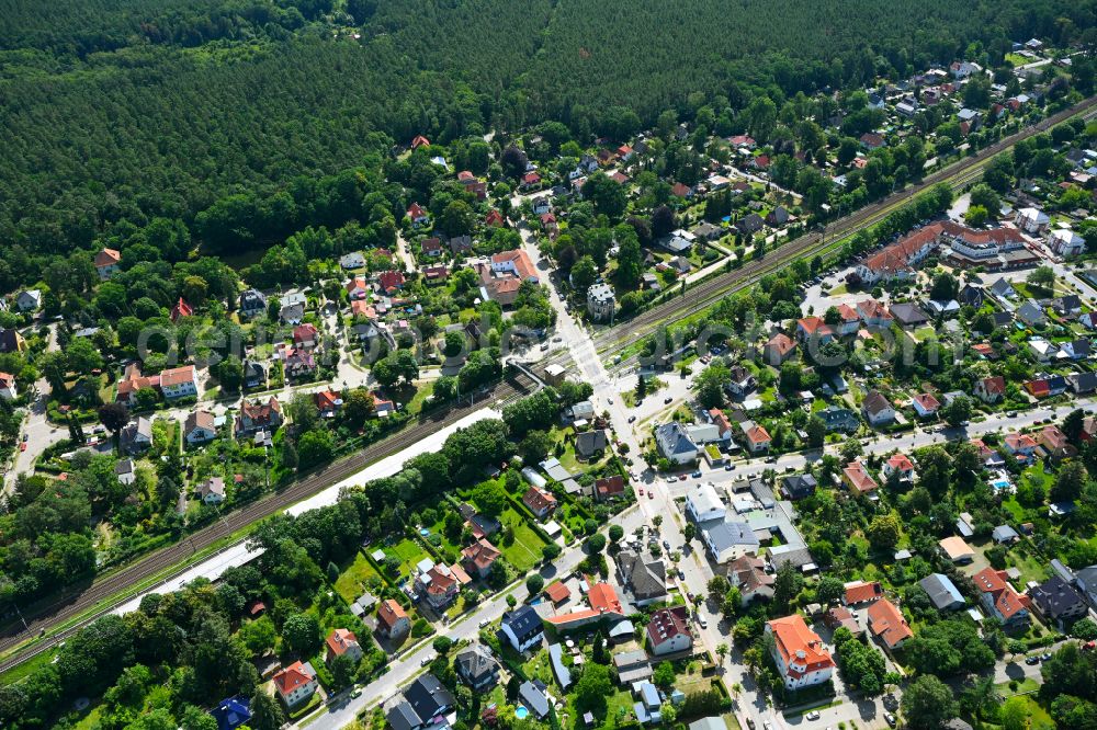 Borgsdorf from above - Surrounded by forest and forest areas center of the streets and houses and residential areas on street Bahnhofstrasse in Borgsdorf in the state Brandenburg, Germany