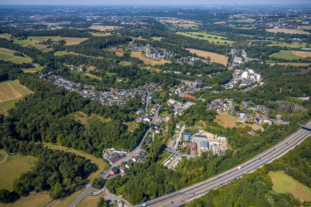 Aerial photograph Buchholz-Kämpen - Surrounded by forest and forest areas center of the streets and houses and residential areas in Buchholz-Kämpen in the state North Rhine-Westphalia, Germany