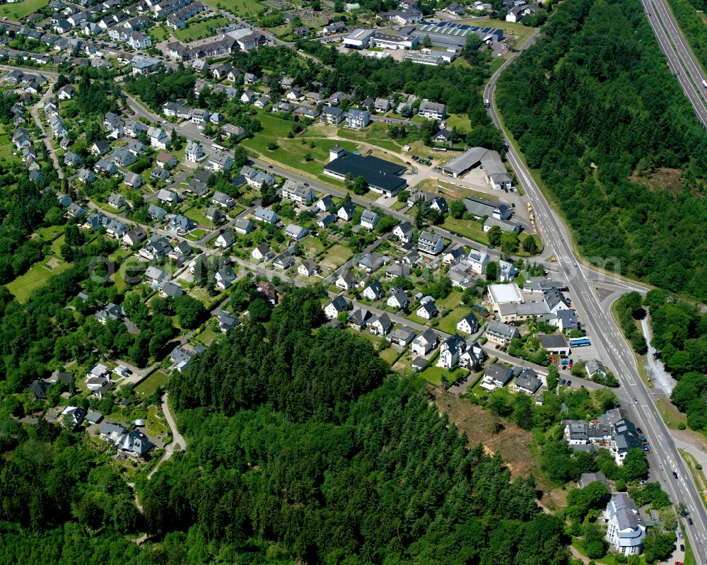 Buchholz from above - Surrounded by forest and forest areas center of the streets and houses and residential areas in Buchholz in the state Rhineland-Palatinate, Germany