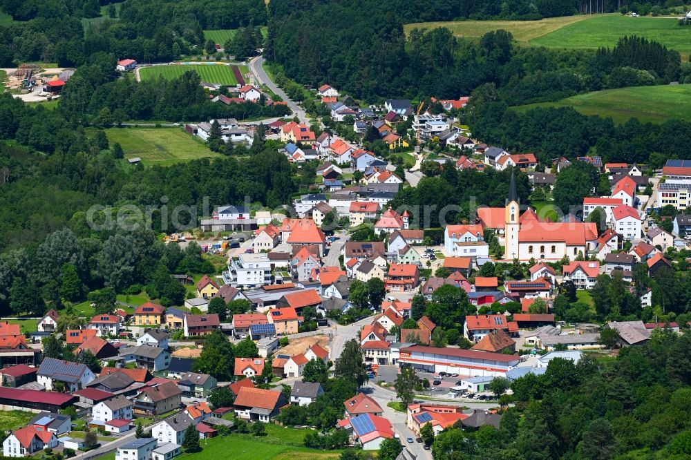 Aerial image Deining - Surrounded by forest and forest areas center of the streets and houses and residential areas in Deining in the state Bavaria, Germany