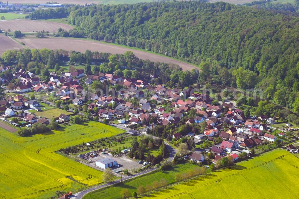 Aerial image Ebenshausen - Surrounded by forest and forest areas center of the streets and houses and residential areas in Ebenshausen in the state Thuringia, Germany